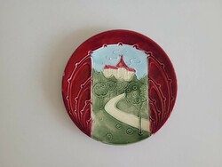 Old majolica wall plate with castle pattern, faience wall decoration