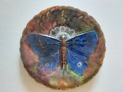 Old faience plate majolica decorative plate with a butterfly pattern