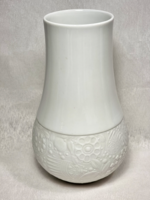 Rosenthal white biscuit porcelain vase, björn wiinblad design, with a floral embossed pattern on the bottom.