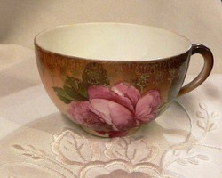 Antique cup with rose pattern