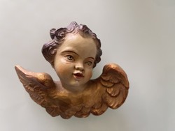 Baroque is beautiful, putto is in very good condition.