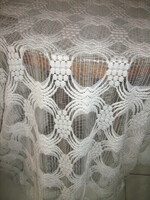 A white huge curtain richly embroidered in beautiful material