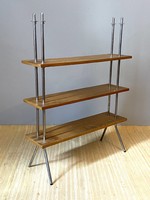 Elegant retro design shelf with wooden panels on a metal stand
