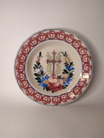 Hard ceramic painted folk wall plate with the old cross abbot's village mark