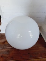 A very large white spherical lampshade without a rim
