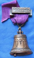 Tura memorial medallion, 1976, ribbon, bell 5 x 5.5 Cm