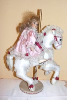 Porcelain doll on horseback