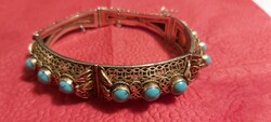 Women's antique silver bracelet with turquoise stones, in good condition.