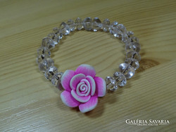 Bracelet decorated with 2 colored fimo flowers. Transparent acrylic form of pearl.