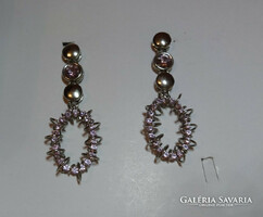 Rose colored crystal earrings with a special design.