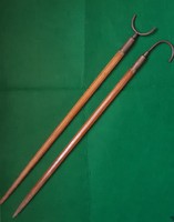 A pair of unique fishing rod holders for collectors