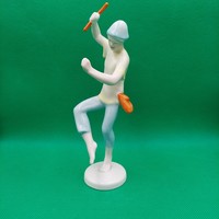 Figure of a boy dancing with a raven house stick