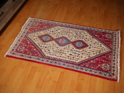 Antique hand-knotted Persian wool rug