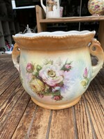 Antique earthenware pot with a large flower pattern