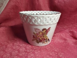 An openwork porcelain bowl with an angelic pattern