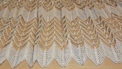 A beige, ready-made curtain with a nice pattern. 357 X 243 cm