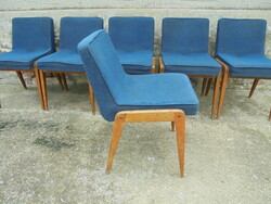 Six retro upholstered chairs together 