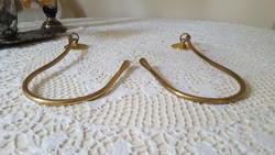 A special pair of brass curtain ties