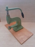 Old cast-iron patent press, circular prym