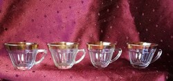 Gold-rimmed coffee cups
