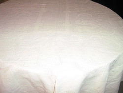 Beautiful cappuccino-colored tablecloth with baroque pattern