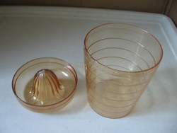 Retro honey-colored plastic cup with a squeeze of lemon