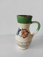 Old glazed jug pot with folk flower pattern