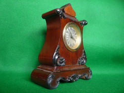 Small wooden fireplace clock.