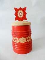 Carved wooden salt shaker with a red Hungarian pattern