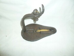 Antique iron miner's lamp with candle, rye