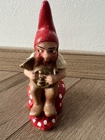 Antique gypsum Christmas decoration with a dwarf sitting on a mushroom and a horn