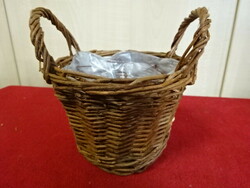 Cane basket, lined with plastic. Its height is 14 cm. Jokai.