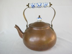 Copper teapot with porcelain tongs