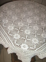 Beautiful white hand crocheted antique lace tablecloth with flower pattern