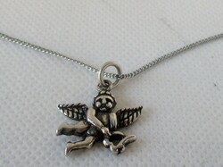 Old silver necklace with a beautiful little angel