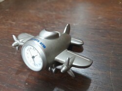 Solid stainless steel heavy flying quartz table clock.
