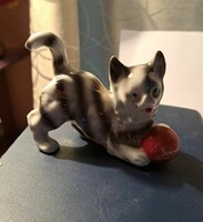 Porcelain cat with ball.