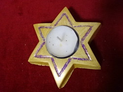 Gypsum star-shaped candle holder with candle. Its diameter is 11 cm. Jokai.