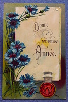 Antique embossed New Year greeting card - lucky horseshoe straw flower with parchment seal