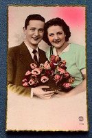 Old nostalgia photo postcard - couple in love with roses from 1942