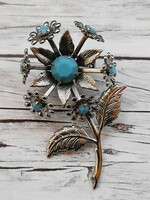 Silver-colored flower-shaped metal brooch, 5.5 cm