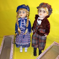 In a pair, 2 porcelain dolls, boy + girl, serially numbered, with original box. Vintage doll.