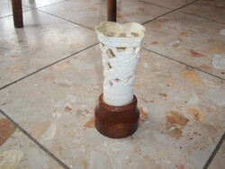 Bone sculpture on wooden pedestal