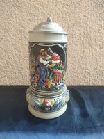 Antique beer mug with tin lid