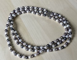 New, three-row cultured two-color string of pearls with a silver clasp