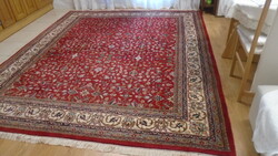 A large hand-knotted oriental woolen Persian rug in beautiful flawless condition