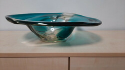 A large, heavy glass bowl