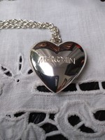 Silver colored marc cain marked pendant with chain