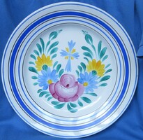 Handmade ceramic wall plate with flower pattern, marked, diameter 23 cm