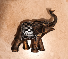 A decorative elephant made of some light metal